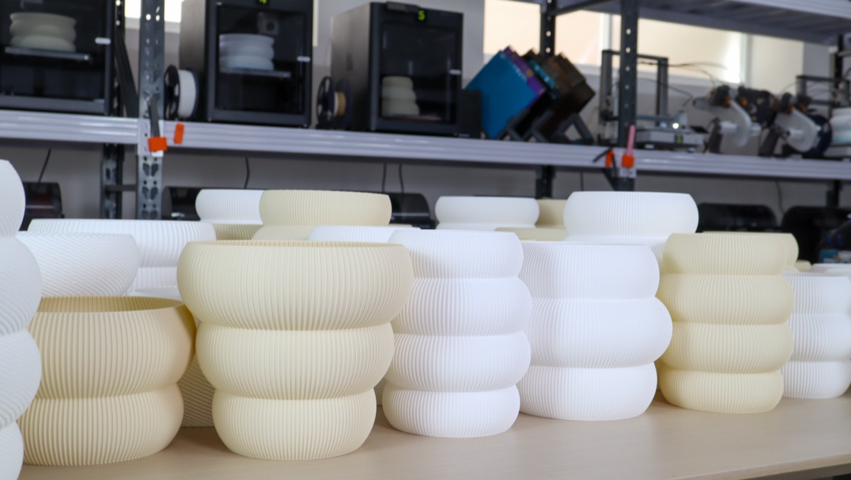 Rows of freshly printed Kumo shades on the studio shelf